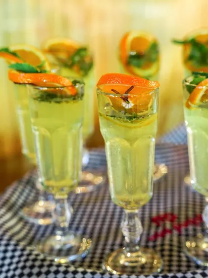 I offer a range of refreshing mocktails and beverages perfect for any celebration. These drinks are crafted with fresh ingredients like mint and orange, and served in elegant glassware.