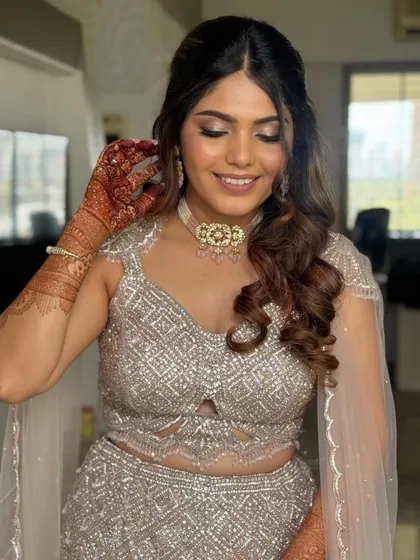 The hair is styled to look full and healthy. This is a versatile look that works well for many different special occasions.