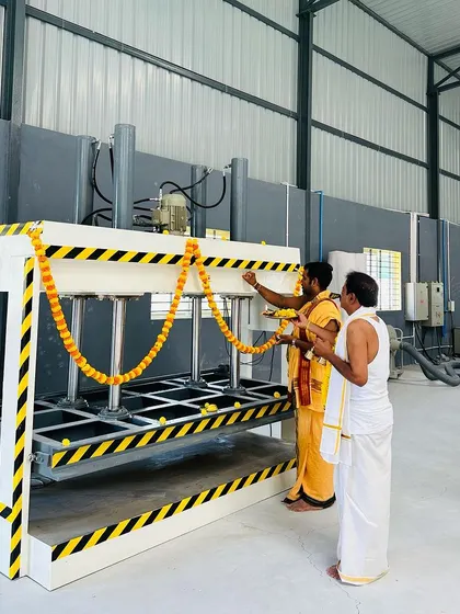 Inaugurating the hydraulic hot press machine at our factory. This machine is crucial for laminating panels evenly, guaranteeing a bubble-free and long-lasting finish.