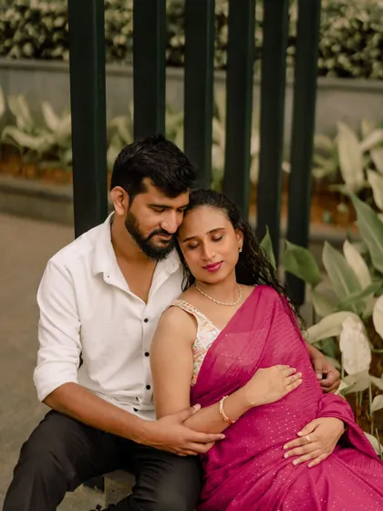 I love when clients incorporate traditional wear into their sessions. The vibrant pink of her saree brings such beautiful color to this candid moment of connection between the couple.