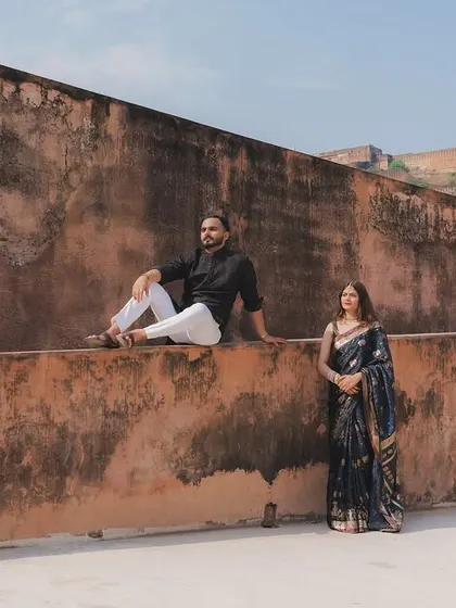 A destination pre-wedding shoot at a historic fort in Rajasthan. I use grand architecture as a backdrop to create a sense of timeless romance, perfect for couples who want their story told in a special location.