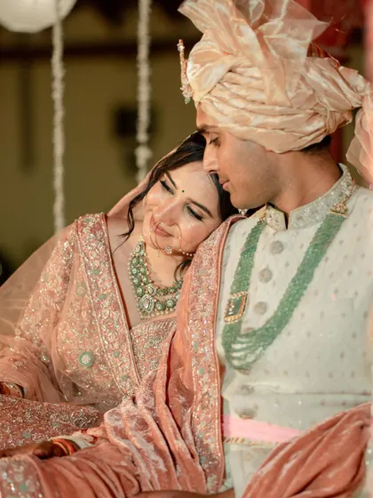 A quiet, tender moment. The makeup is flawless even in close-up, focusing on a natural, dewy finish.