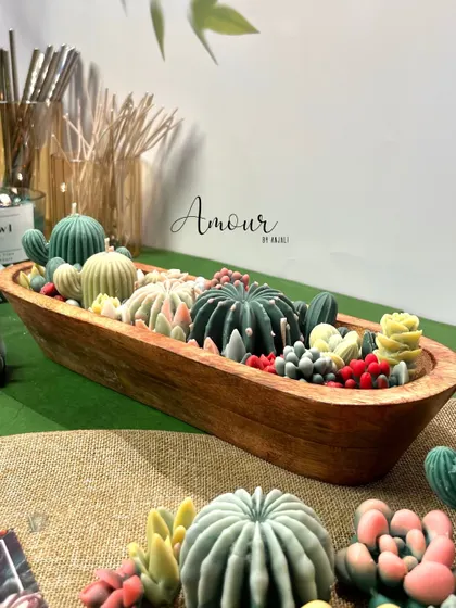 Another angle of the Succulent Obsession candle, showcasing the variety of cactus and succulent shapes and colors that make it a true statement piece.
