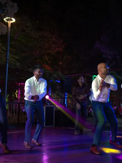 A dynamic action shot of the groomsmen's performance, full of energy and fun.