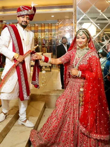 The grand entrance of the bride and groom. Her makeup is designed to be flawless from every angle, ensuring she looks stunning throughout the ceremony.
