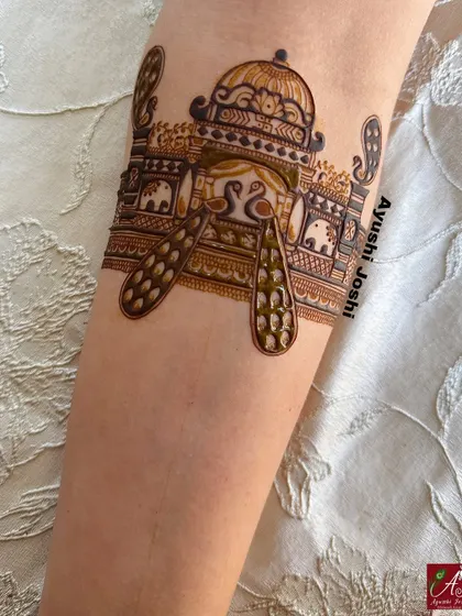 A startup of a bridal arm band, showing the outline of a palace dome with peacocks and elephants.