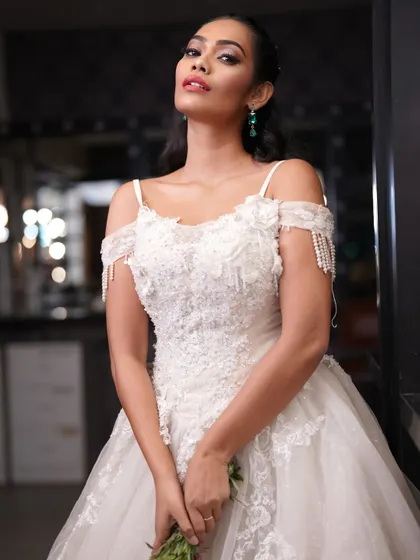A full-length shot of a Christian bride in a beautiful white gown. The styling is elegant and timeless.