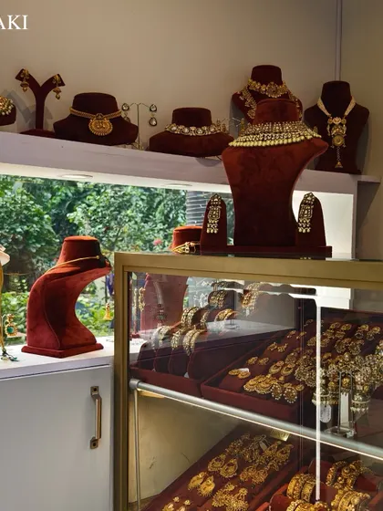 An interior shot of Minaki, showing a variety of necklaces and earrings displayed on busts and shelves, highlighting their extensive collection.
