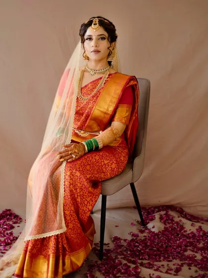 An early morning beauty. This South Indian bride's look is regal and timeless, with makeup that enhances her features and complements her silk saree.