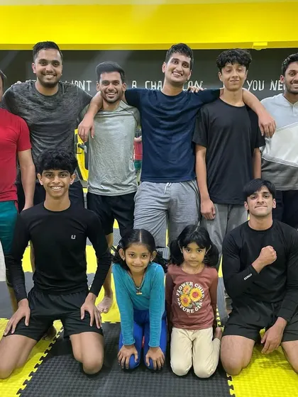 A group photo showing the diversity of our team, with our youngest female members kneeling proudly in the front row.