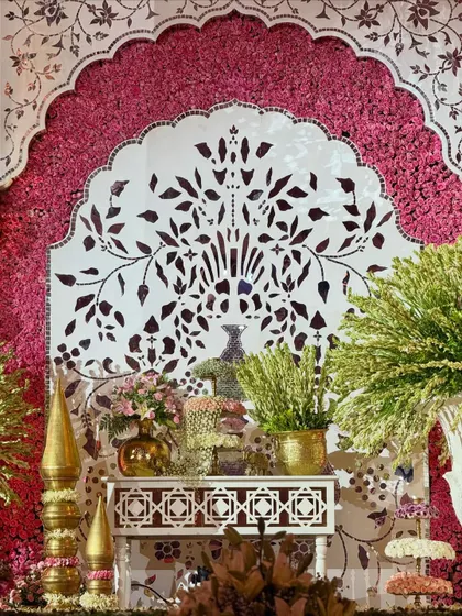 A close-up of the detailed craftsmanship. This panel, featuring a tree-of-life motif, is framed by a wall of vibrant pink flowers, showcasing our focus on intricate, artistic elements.