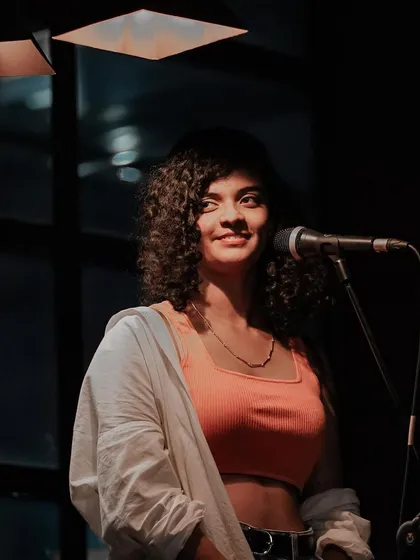 A smile for the audience at Nosh Haus in Kochi. In these smaller settings, I can really connect with everyone and share stories between songs.