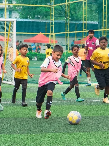 Young players engaged in a practice game. Small-sided matches are a key part of our training, allowing players to apply their skills in a real-game context while improving decision-making.