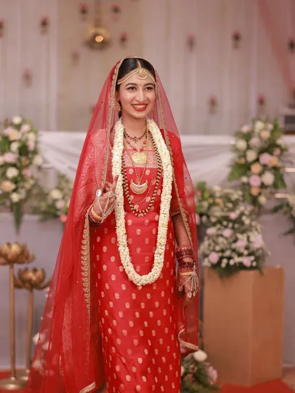 A full-length shot of the bride's muhurtham look. She looks stunning from head to toe.