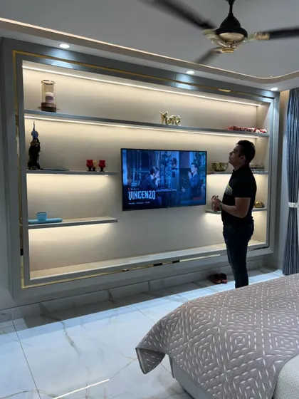Final inspection of the TV unit, ensuring the lighting is perfect.