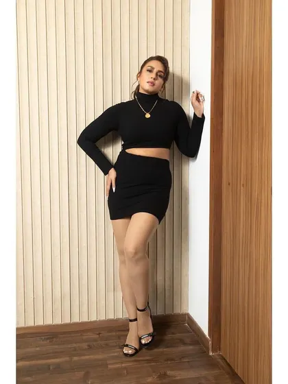 The full look of the black Superdown set. It's a simple yet incredibly effective outfit for a promotional event.