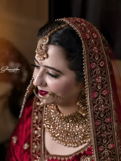 A classic, elegant portrait with soft lighting that beautifully illuminates the bride's features.