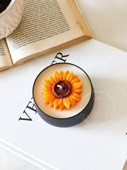 A single Sunflower tin jar candle, a perfect, minimalist piece of decor.