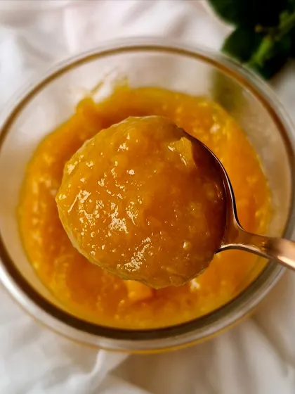 A scoop of our vibrant Peach and Apricot Confit.