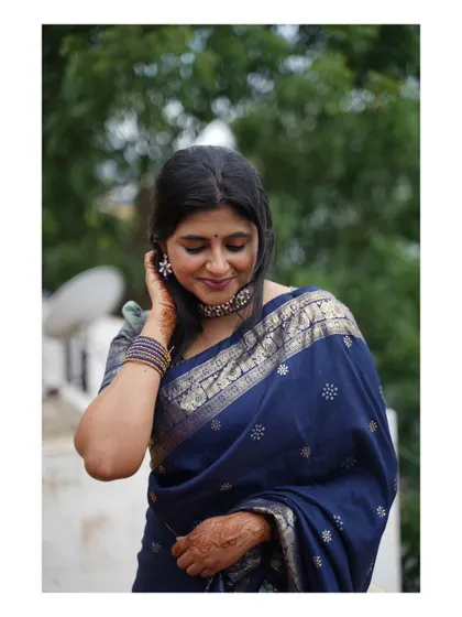 A beautiful blue saree with intricate zari work. The elegance of a saree is timeless.
