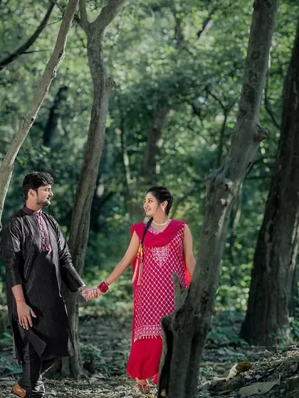 A walk through the woods in traditional attire. This shot combines the beauty of nature with the elegance of ethnic clothing for a unique pre-wedding photo.
