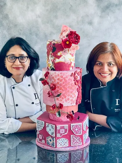 Posing with my mentor, Chef Deepali Sawant, and our collaborative Moroccan-themed wedding cake, featuring intricate tile work and handmade sugar flowers.
