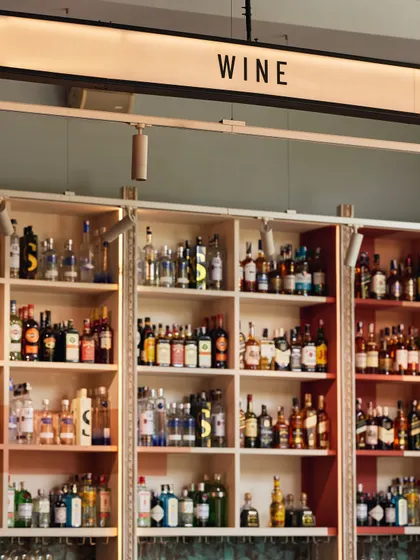 The view from behind the bar, looking out at our extensive selection of wines. We have a pour for every palate.