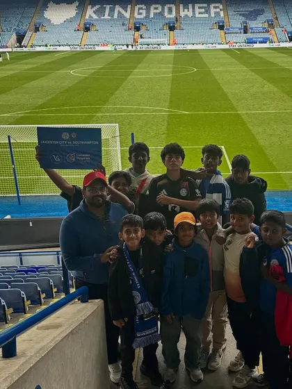 The team posing for a group photo inside King Power Stadium, home of Leicester City FC.