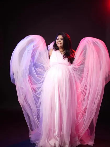 Feel like an angel in this pink maternity gown with flowing tulle wings. It creates such a dramatic and beautiful effect for photos.