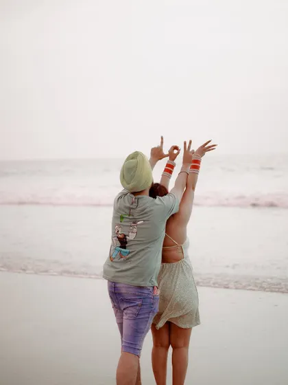A fun and creative pose spelling out "LOVE" with their hands. This adds a touch of playfulness and personality to their pre-wedding gallery.