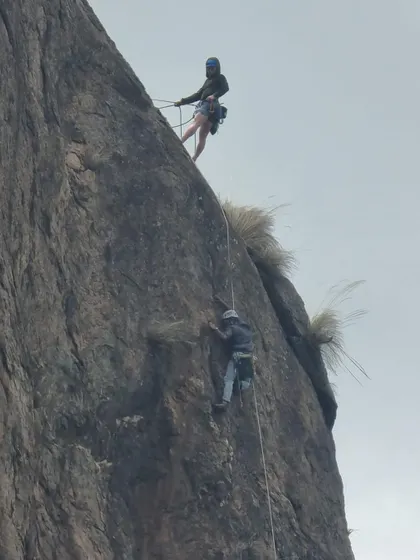 Two climbers rappelling down a steep face at Talai Betta. Safely getting down is just as important as getting up.