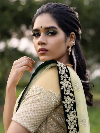A striking portrait of the model Malavika. The intense eye makeup is the star of the show, demonstrating how to create a look that is both artistic and beautiful.