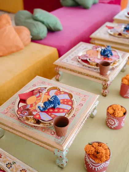 Low seating with traditional "bajot" tables for the Rajasthani-themed welcome lunch. The custom thalis and kulhads for chai added to the authentic, heartwarming charm of the gathering.