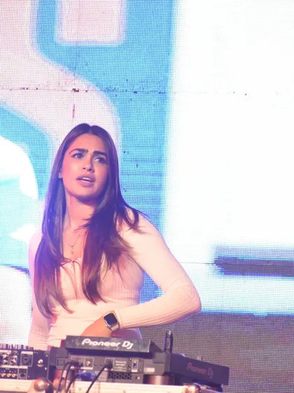 A candid shot from a large festival stage, catching my reaction to the amazing crowd energy. These unscripted moments are often the most memorable.