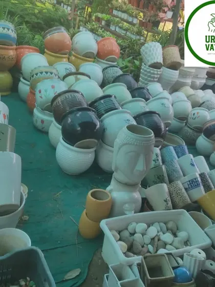 More decorative pots, including some with a Buddha head design.