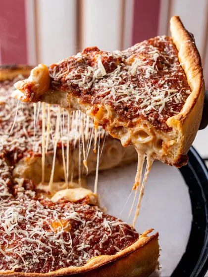 Another angle of an incredible deep-dish pizza cheese pull. We often capture multiple versions of key shots to provide clients with a variety of options.