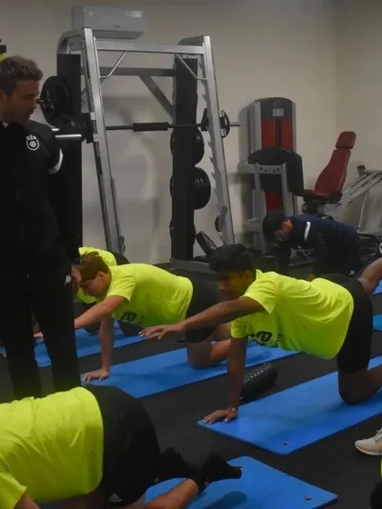 Our goalkeeper Sunay participating in a gym session in Portugal, focusing on core strength and flexibility as part of his holistic training.