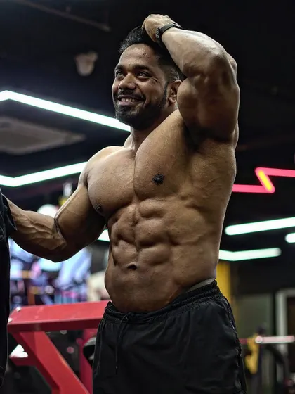 A candid happy moment, but still showing a shredded midsection.