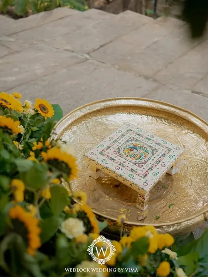 For this Haldi, we focused on a vibrant yellow theme with rustic touches. We used hanging cane baskets filled with yellow flowers, lush greens, and traditional brass urlis to create a warm and sunny celebration.