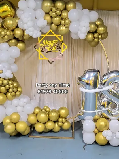 The same 18th birthday setup without the plinths, showing the versatility of the balloon arch.
