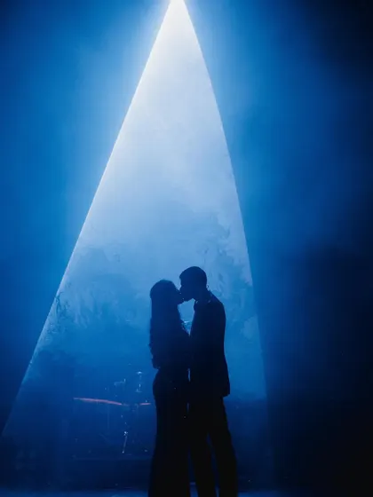 Creating that perfect, dreamy moment for a couple's first dance is my specialty. This silhouette shot captures the romance I help bring to life on stage, making it a memory you'll cherish forever.