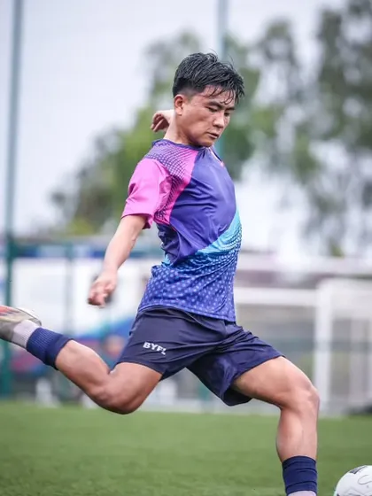A player unleashes a powerful shot during a DPDL Super Cup match. We train our players to be confident and decisive in front of goal.