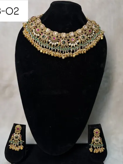 My heritage set B-02 is a classic choker with multi-color stones and pearl drops. It's a versatile piece that can be rented for weddings, receptions, or festive events.