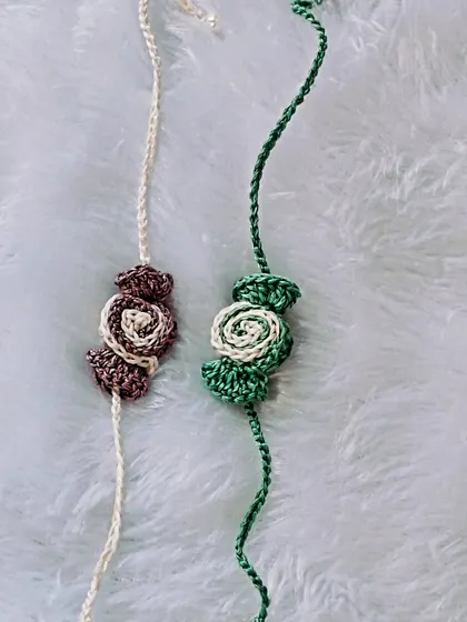 Earthy and elegant, these two-toned rose rakhis in brown and green are a unique, subtle option for Raksha Bandhan.