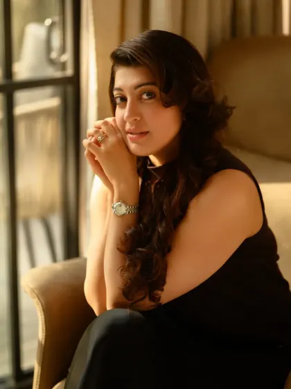 A sun-kissed portrait of actress Pranitha Subhash. The natural light coming through the window creates a beautiful, soft effect that highlights her features in a very gentle way.