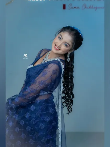 A playful pose from the same event, showing the model's personality.