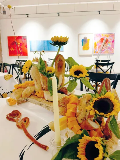 The full tablescape, a feast for both the eyes and the palate, perfectly complementing the art gallery setting.