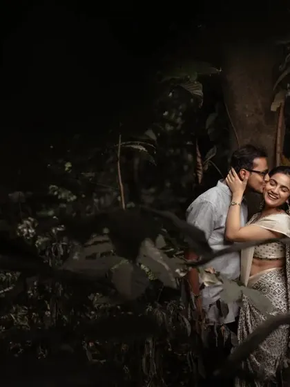 A romantic, stolen moment in a dark, leafy forest. We excel at using low light and natural surroundings to create moody and intimate pre-wedding portraits.