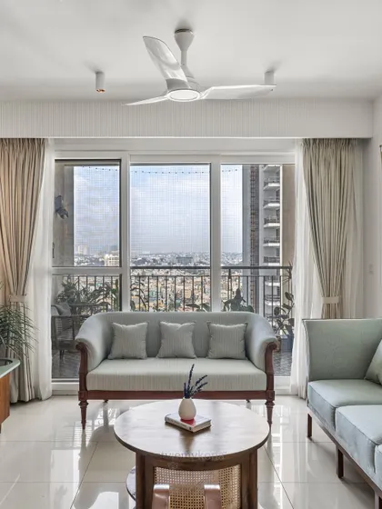 This shot highlights the beautiful view from the living room window, showing how we design spaces to connect with their surroundings.