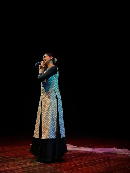A solo Kathak dancer captivates the audience with her expressive storytelling.